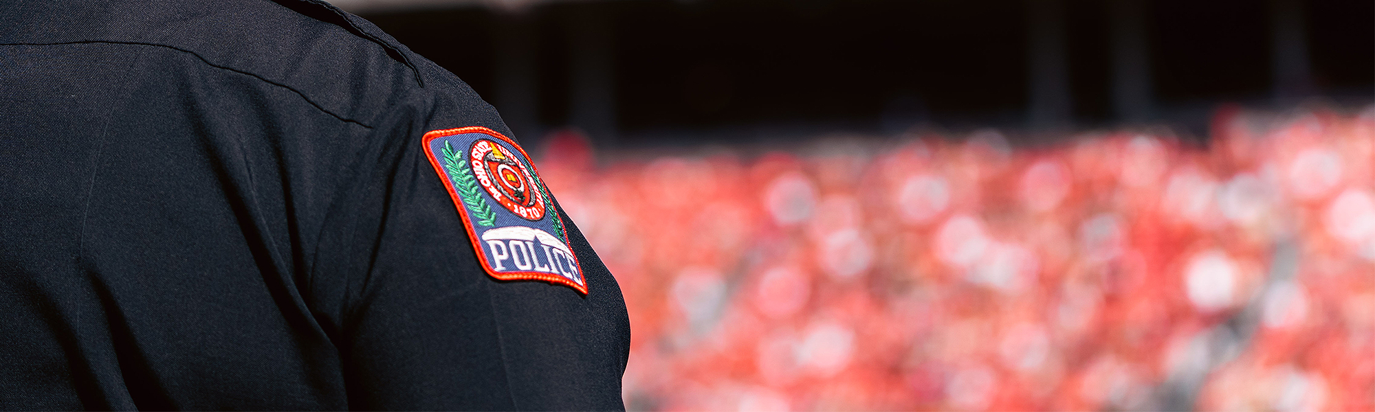 Close up view of the OSUPD badge on the shoulder of an officer