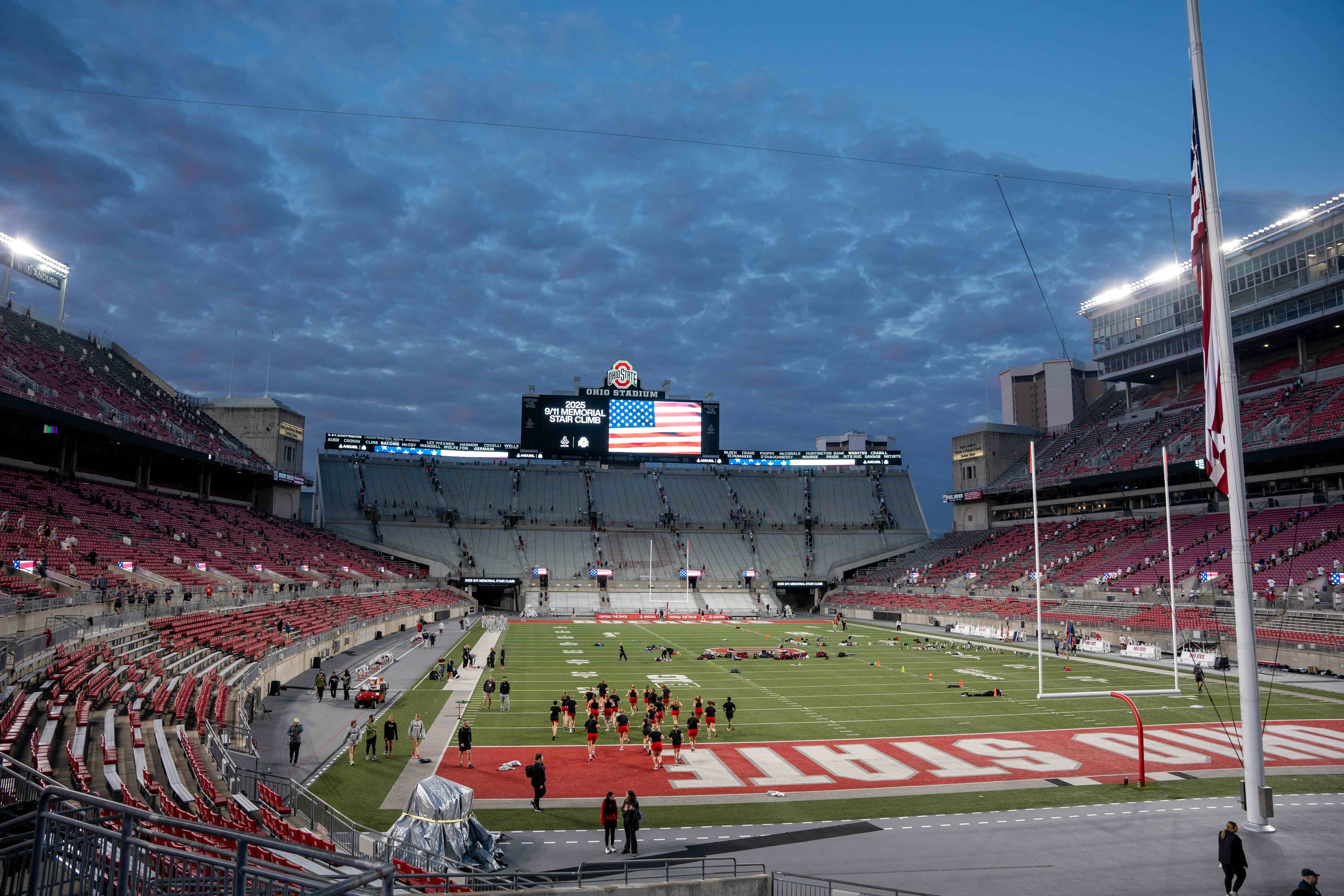 A view of Ohio Stadium with an American flag on the jumbotron.