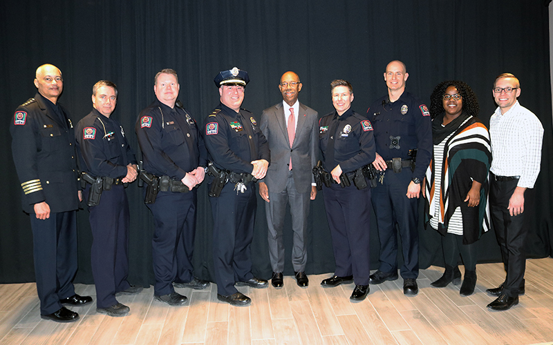 President Drake and DPS officials posing for a photo at the awards ceremony