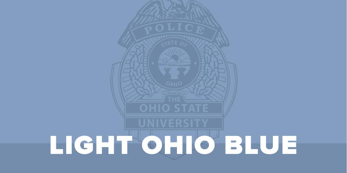 a sign of a police badge with the words in front of it, light ohio blue