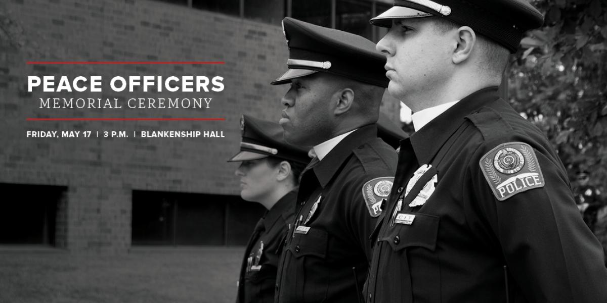 police officers at a memorial service in front of Blankenship Hall