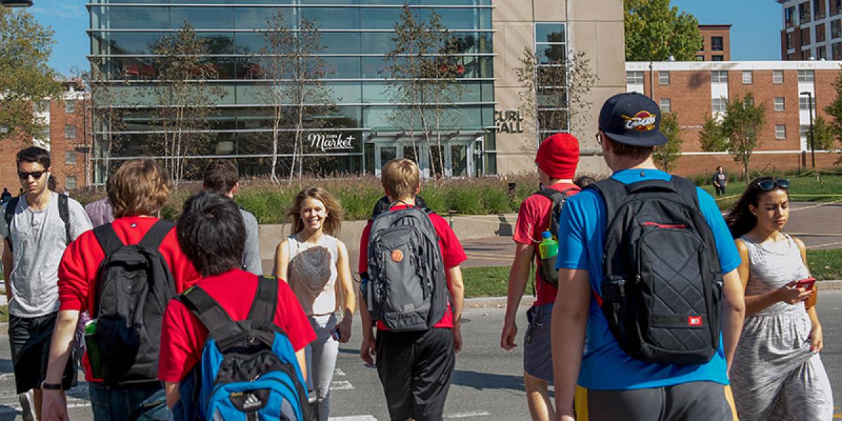 students crossing the street at a crosswalk