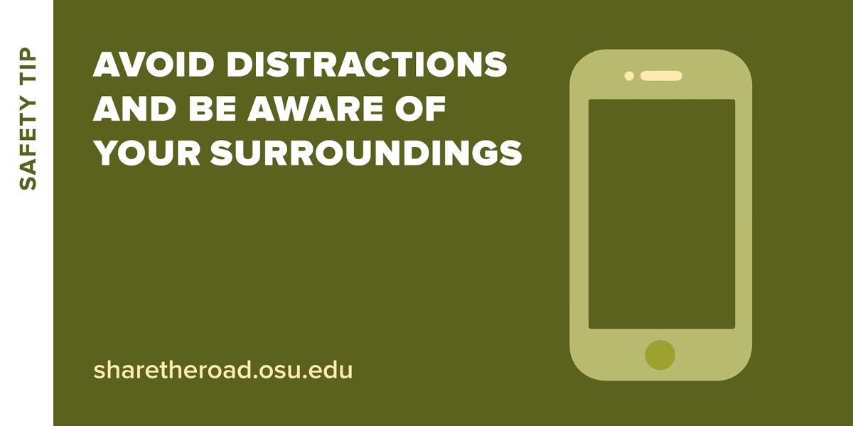 cell phone with words avoid distractions and be aware of surroundings