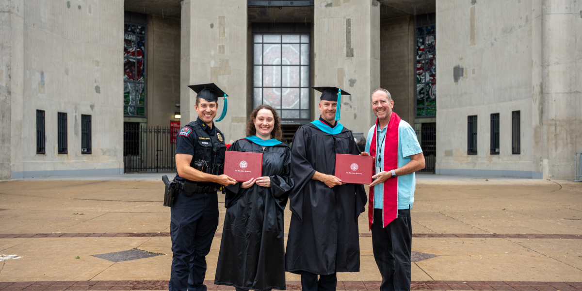 DC Horujko, Merle, Detective Manley and Jason standing, smiling.
