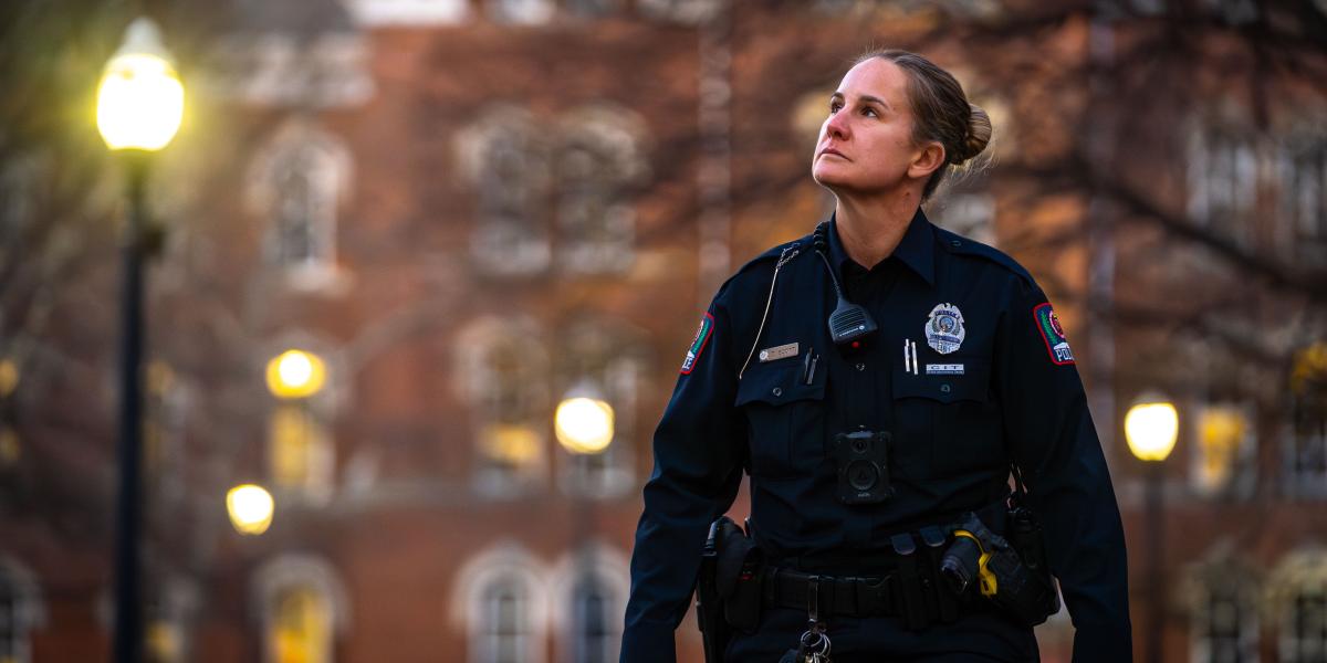 Officer Scott on patrol at dusk on the oval