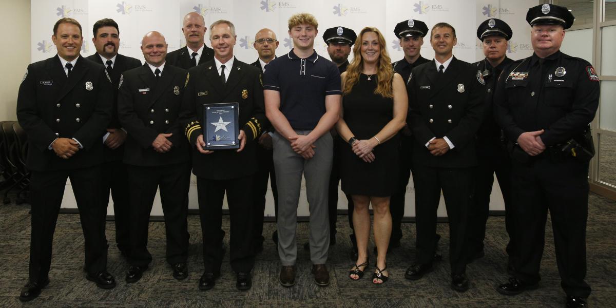 Officers standing with 16-year-old Ethan McKendry