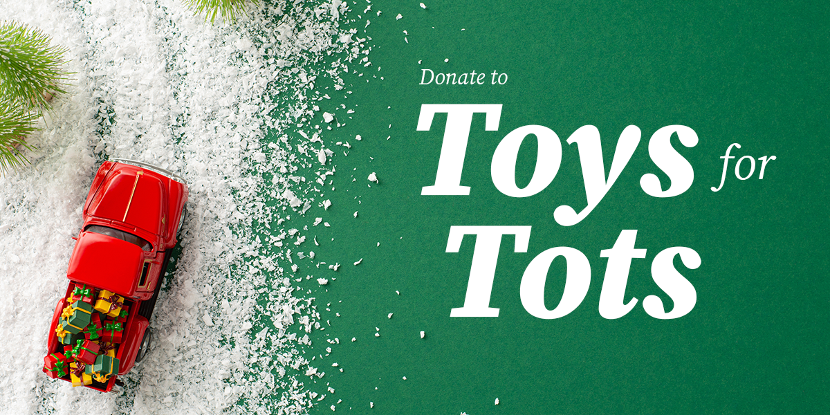 Graphic of a red toy truck hauling presents with text "Donate to Toys for Tots"
