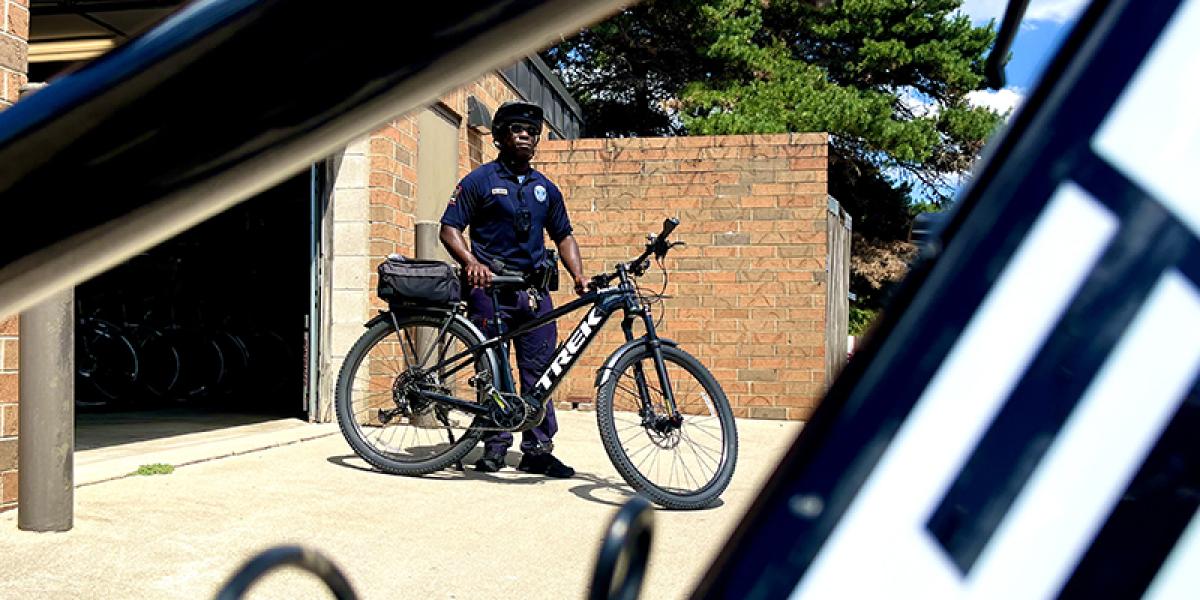Officer standing next to a bicycle
