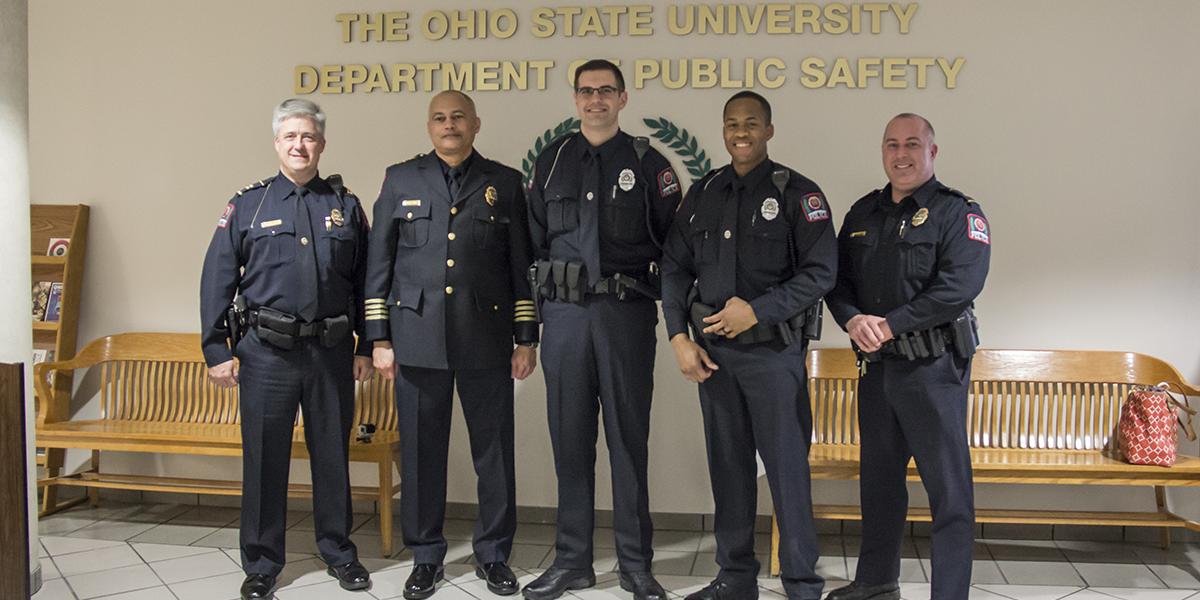 Five police officers at pinning ceremony