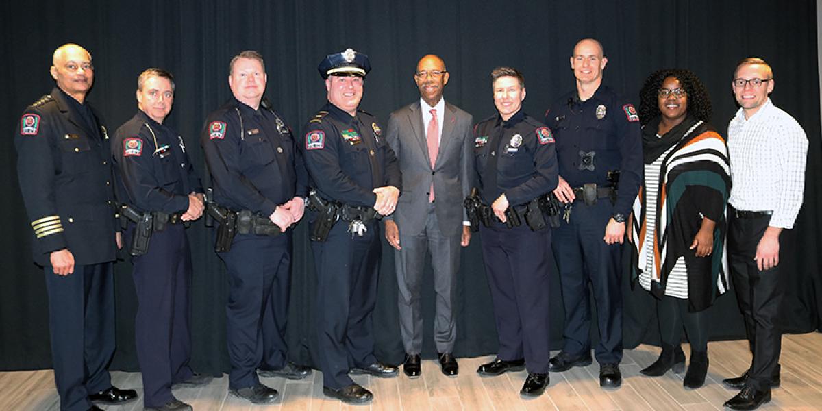 President Drake and DPS officials posing for a photo at the awards ceremony