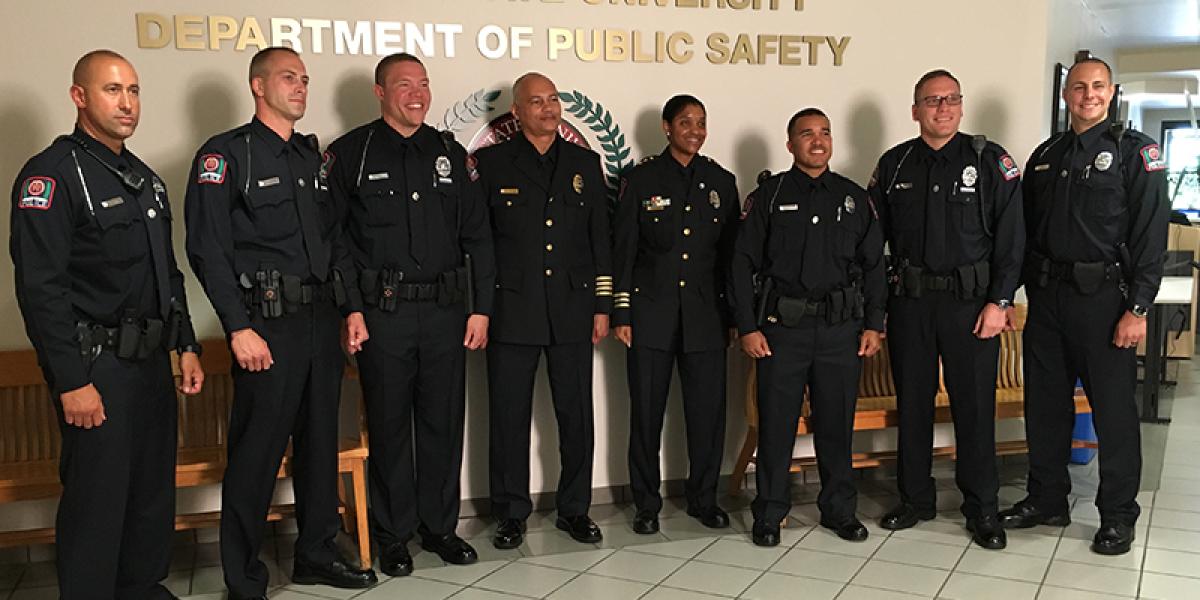 six new OSU Police officers stand alongside Chief Stone and Deputy Chief Spears-McNatt