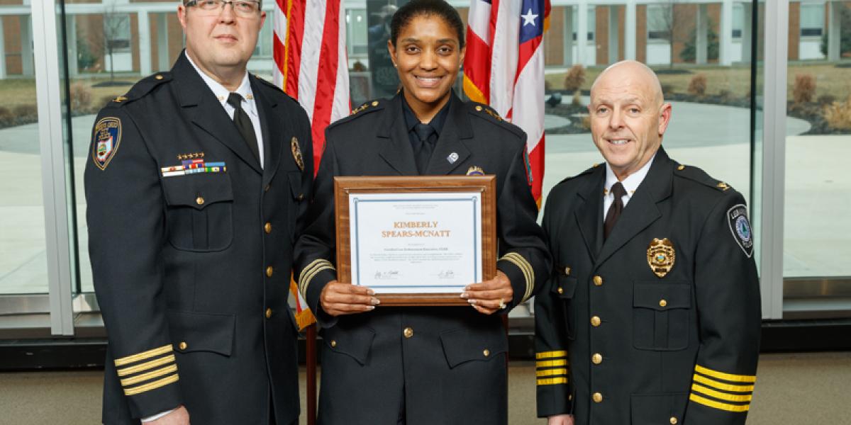 OSU Police Chief Spears-McNatt displays certificate from Law Enforcement Executive (CLEE) program