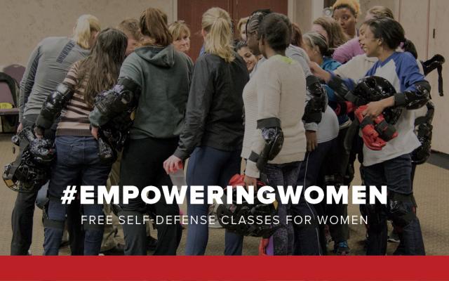 a group of women taking the RAD class, circled together