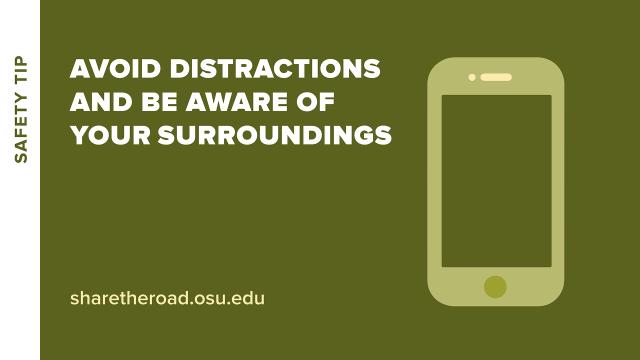 cell phone with words avoid distractions and be aware of surroundings
