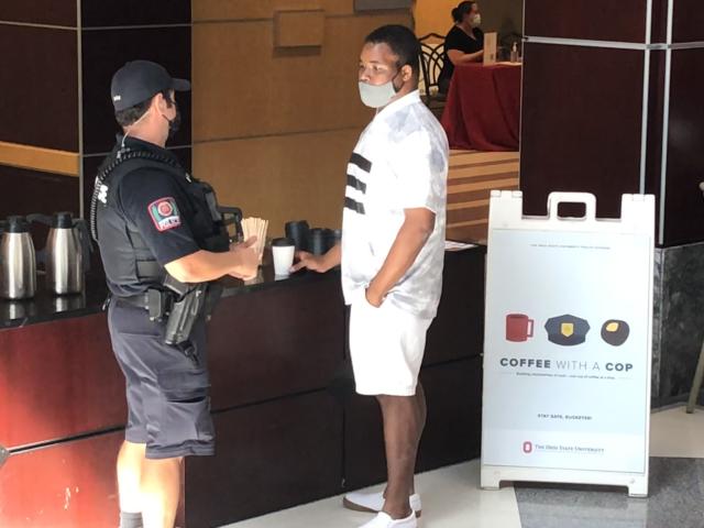 Photo of police officer and student at coffe with a cop event