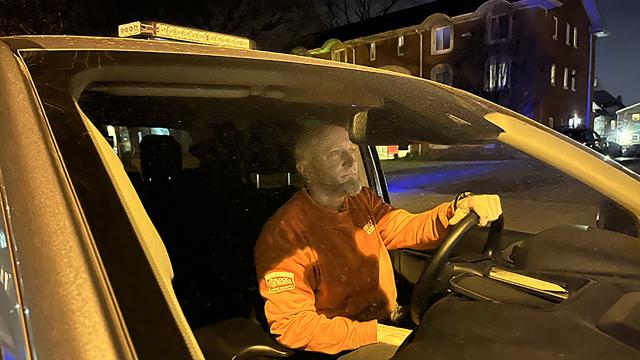 Block by Block staff member driving car at night