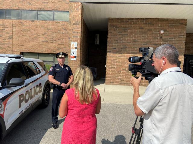 Officer reporter and camera man