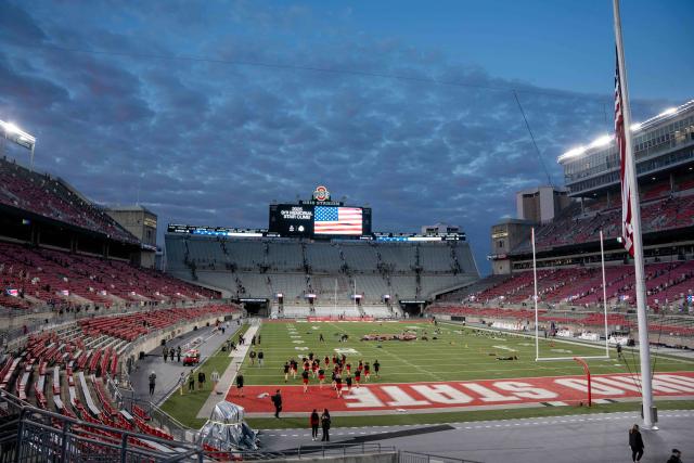 A view of Ohio Stadium with an American flag on the jumbotron.