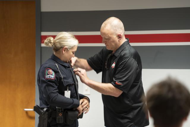 Officer Kovach being receiving her pin.