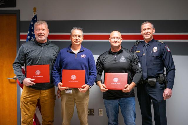 Photo of 4 officers receiving an award