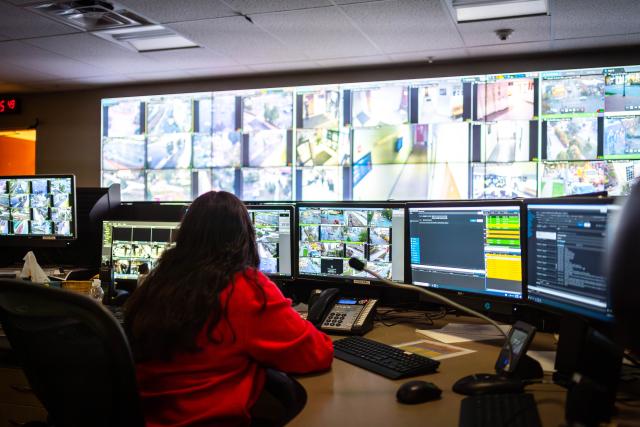 Surveillance room with many displays from camera feeds across campus