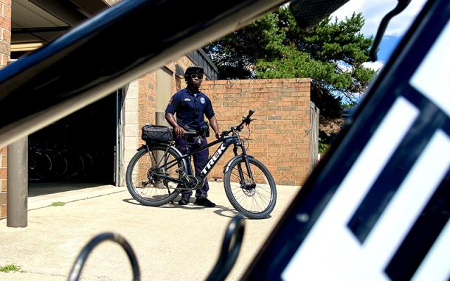 Officer standing next to a bicycle