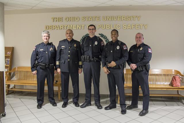 Five police officers at pinning ceremony