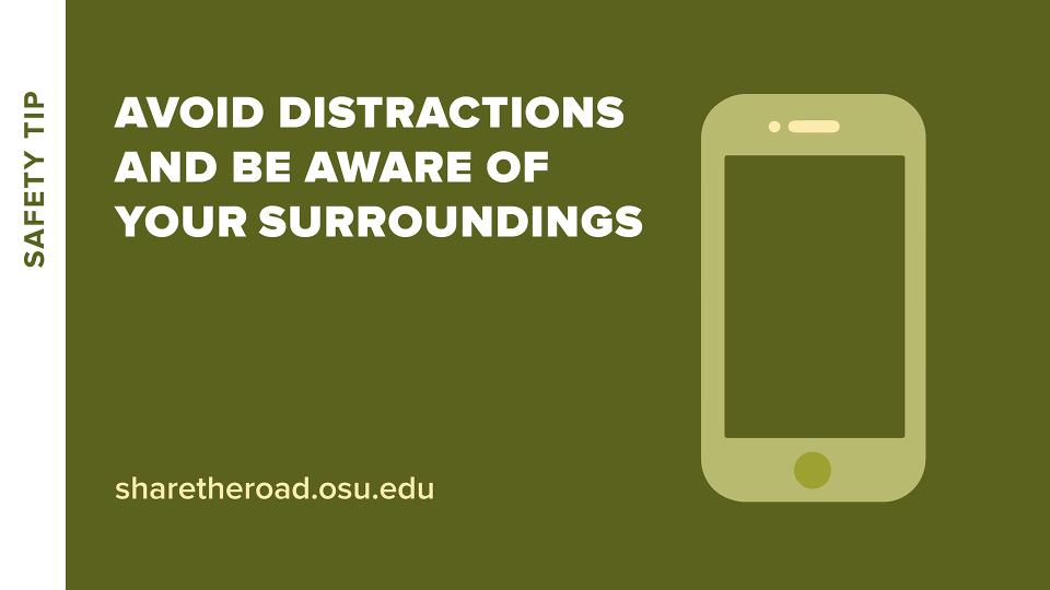cell phone with words avoid distractions and be aware of surroundings