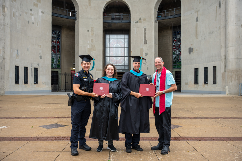 DC Horujko, Merle, Detective Manley and Jason standing, smiling.