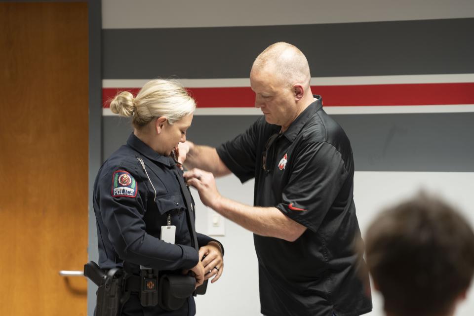 Officer Kovach being receiving her pin.