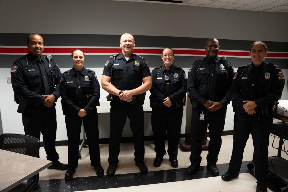 Five officers standing with Deputy Chief Eric Whiteside.