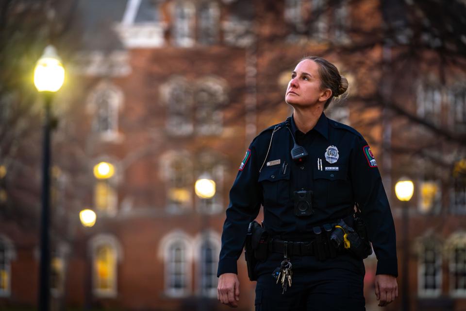Officer Scott on patrol at dusk on the oval
