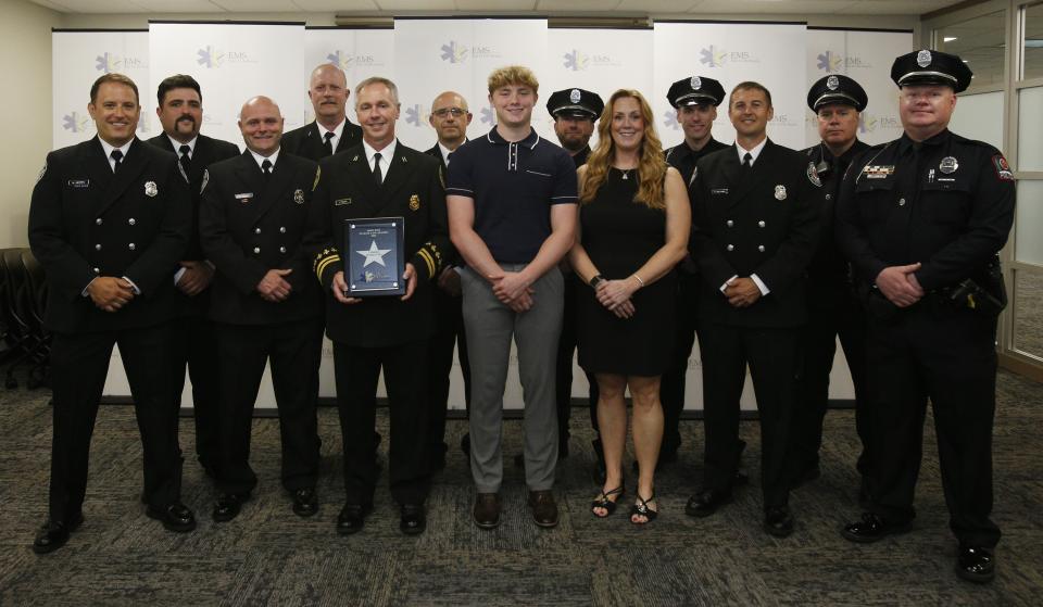 Officers standing with 16-year-old Ethan McKendry