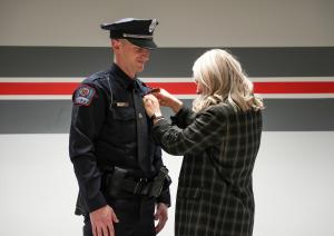 Officer Krasa being 'pinned' by a loved one.